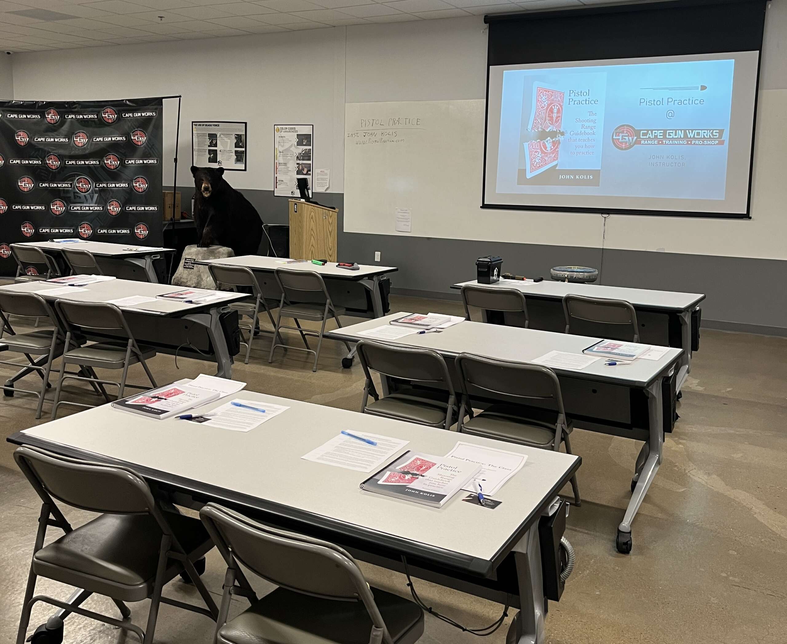 Wide-angle view of a classroom set up to teach Pistol Practice