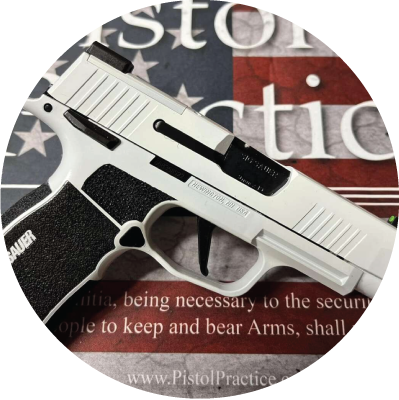 Sig P365 finished in Stormtrooper white placed on top of a custom Pistol Practice American flag mat