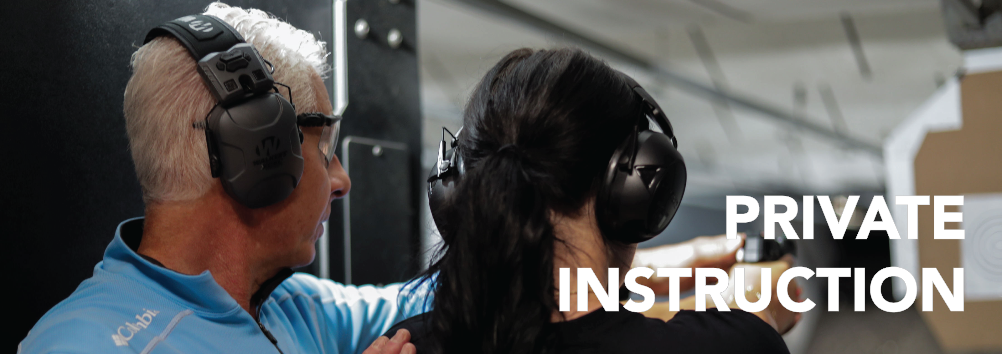 A woman shooting at a bullseye target under the close supervision of an instructor, with his hand on her shoulder and pistol, and the words 'PRIVATE INSTRUCTION' superimposed on the right side